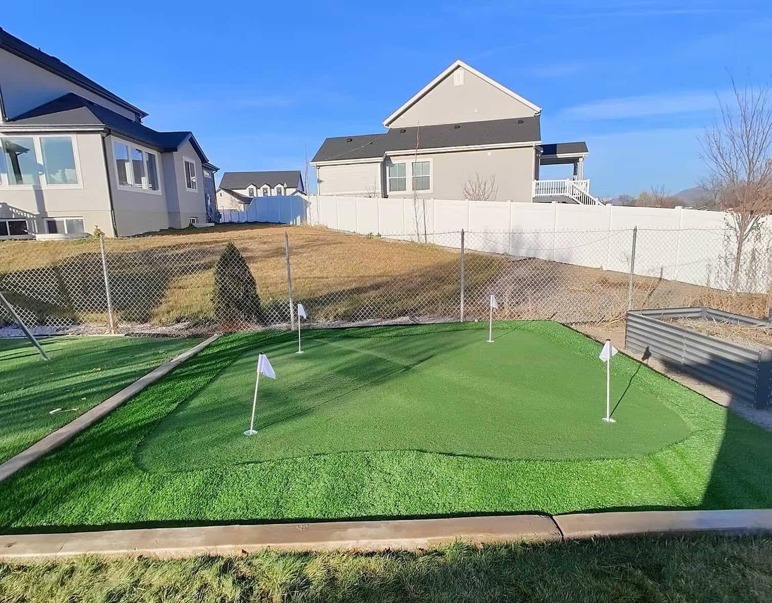 Finished backyard putting green with artificial turf in Utah